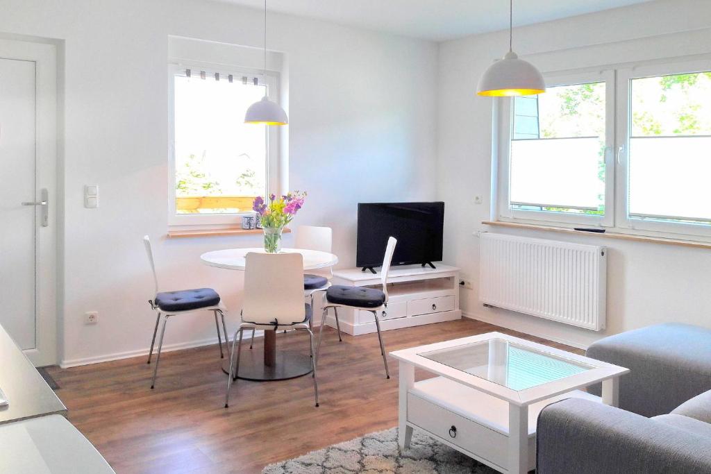 a living room with a couch and a table at Dobra in Lübbenau