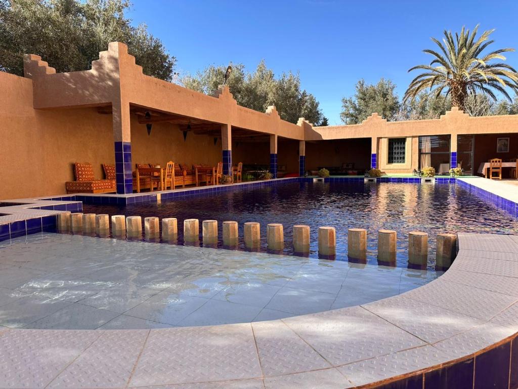 a swimming pool in the middle of a house at Kasbah Ait ben Damiette in Skoura