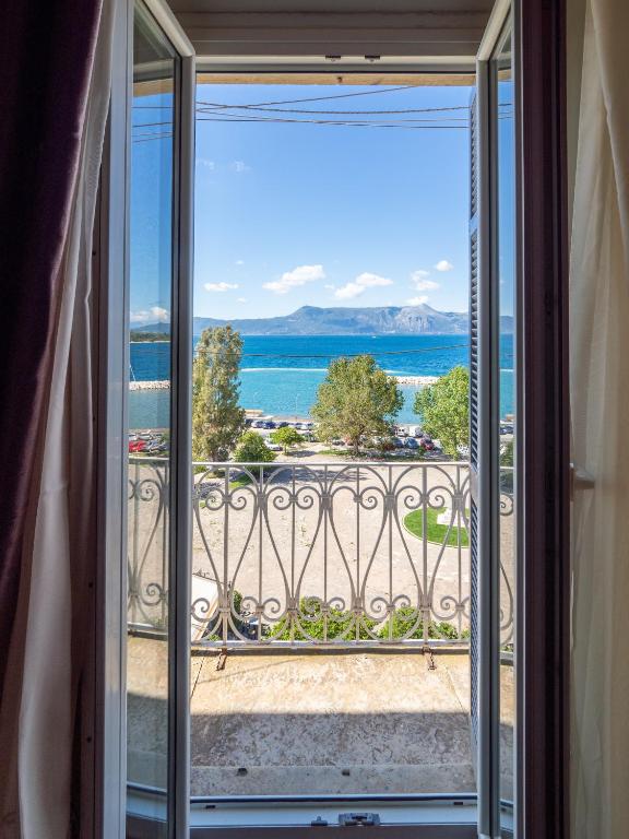 a view from a window of the ocean at Acropol Seaview Apartment in Corfu Old Town by the Old Port in Corfu