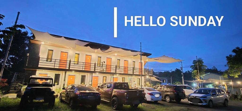 a group of cars parked in front of a building at Kasyatel in Impasugong
