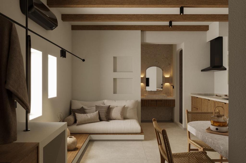 a living room with a couch and a table at Aiolos Suites in Rhodes Town