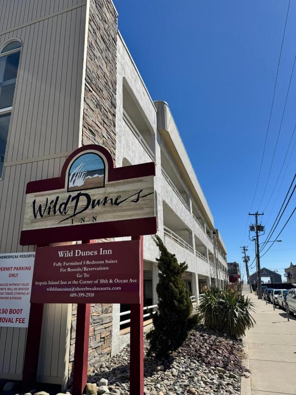 a sign in front of a building at Wild Dunes Inn in Ocean City