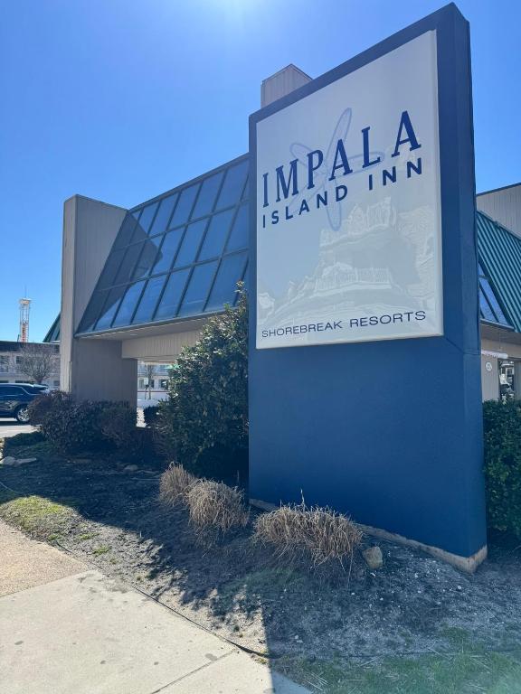 a sign for an india island inn in front of a building at Impala Island Inn in Ocean City
