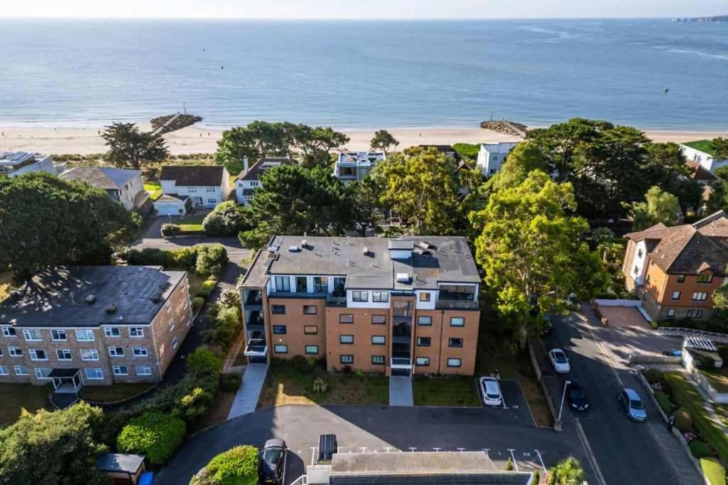 an aerial view of a building and the beach at Sandy Shores - Moments from Blue Flag Sandbanks Beach in Poole