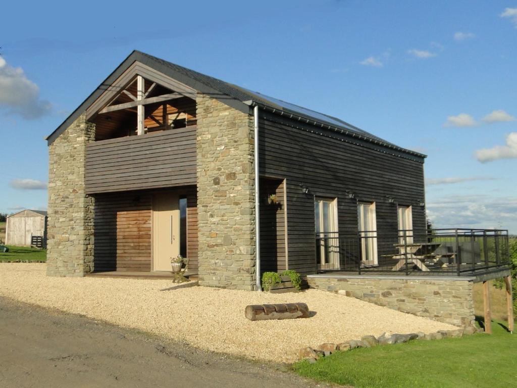 a black building with a large window on top of it at Holiday Home A Pas de Loup in La-Roche-en-Ardenne