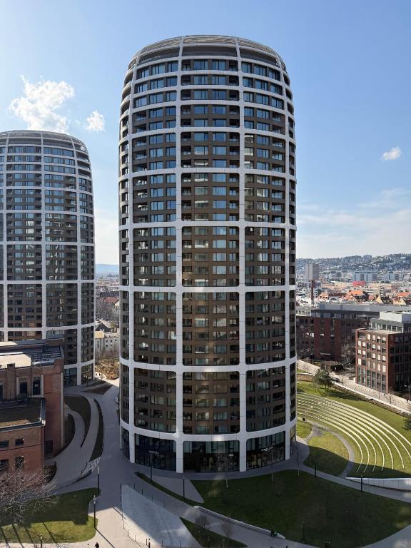 two tall buildings in a city at Sky Park by MISSONI in Nivy