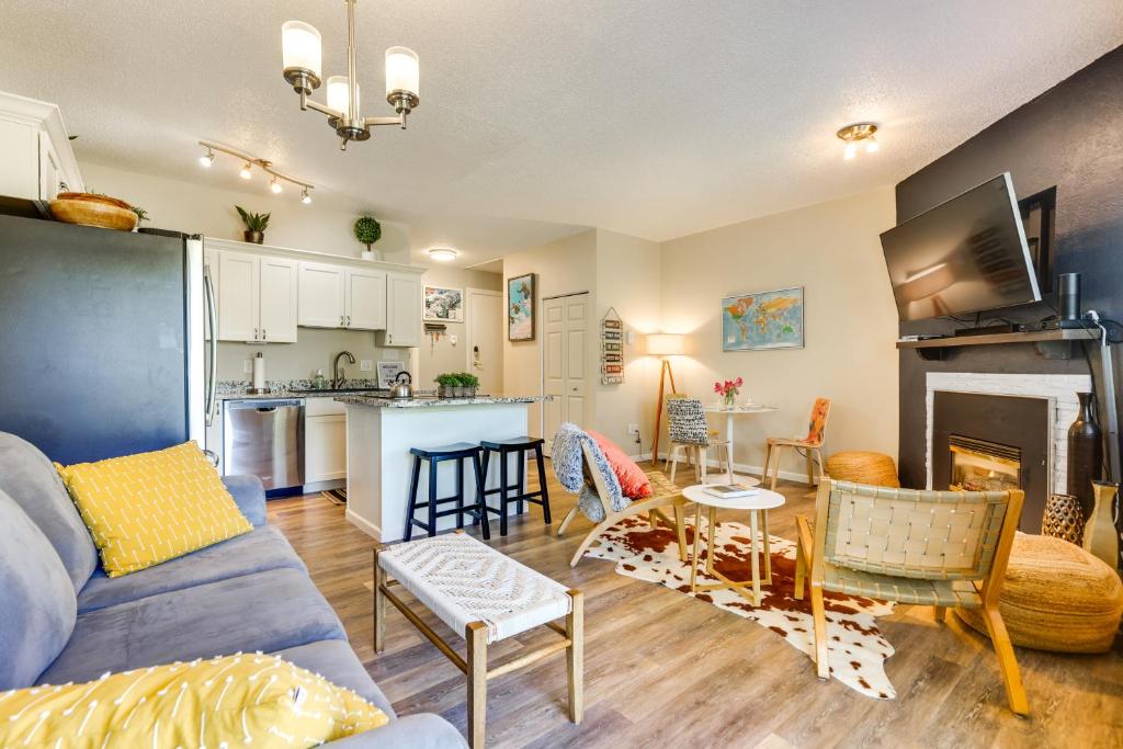 a living room with a couch and a table and a kitchen at Ski Getaway! Mtn-View Condo Near Keystone Resort in Keystone