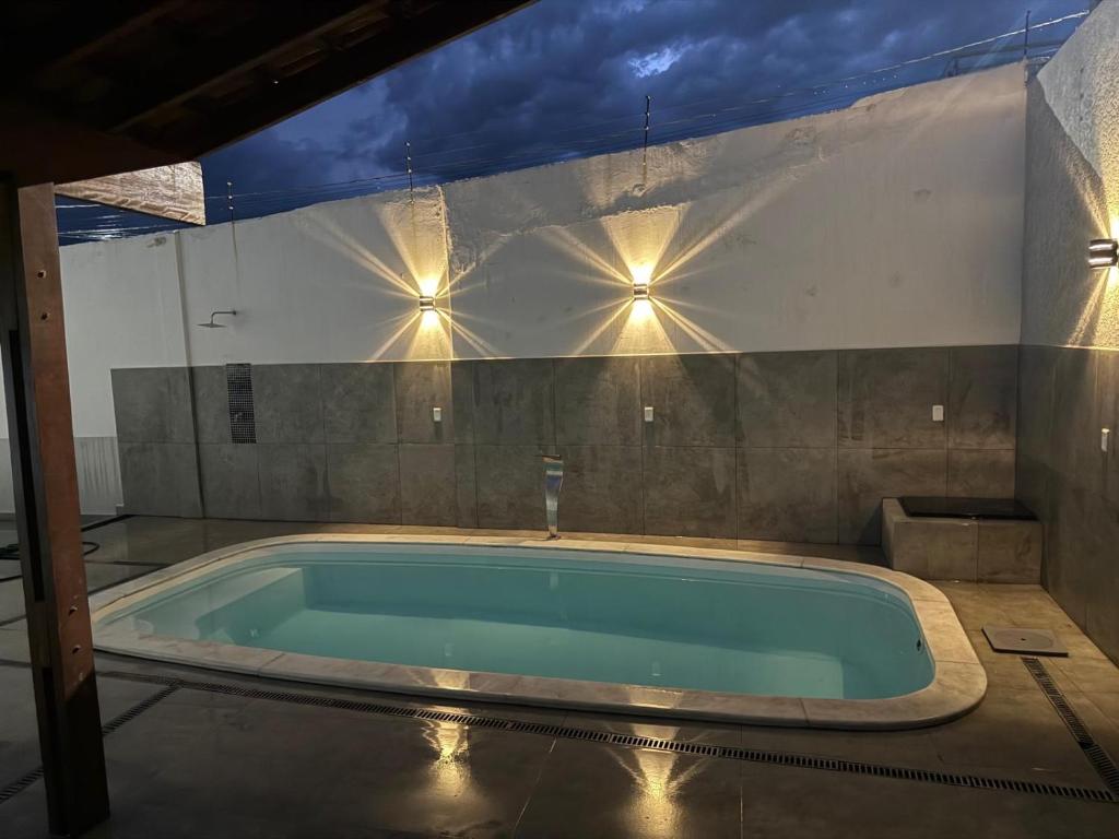 a jacuzzi tub in a room with lights at Espaço Guga in Sorocaba
