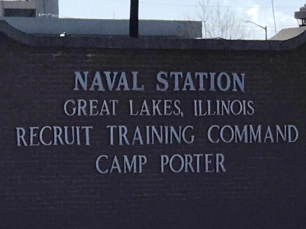 a sign on the side of a building at Cozy 2 bed Apt 2 train stops to the Naval Base in Highwood