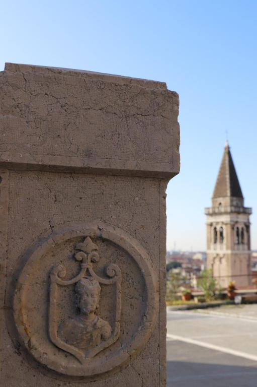 a stone statue on the side of a building at Stelle di Verona - Andromeda in Verona