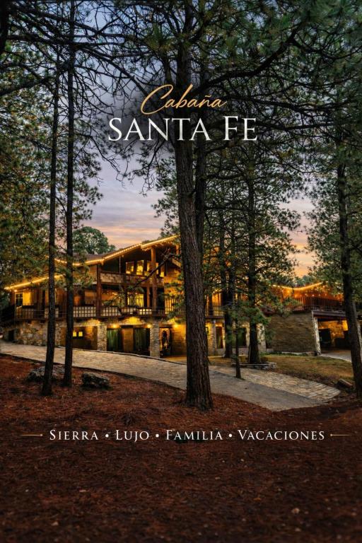 a building with the words santa fe in front of it at Cabaña Santa Fe in Mesa de las Tablas