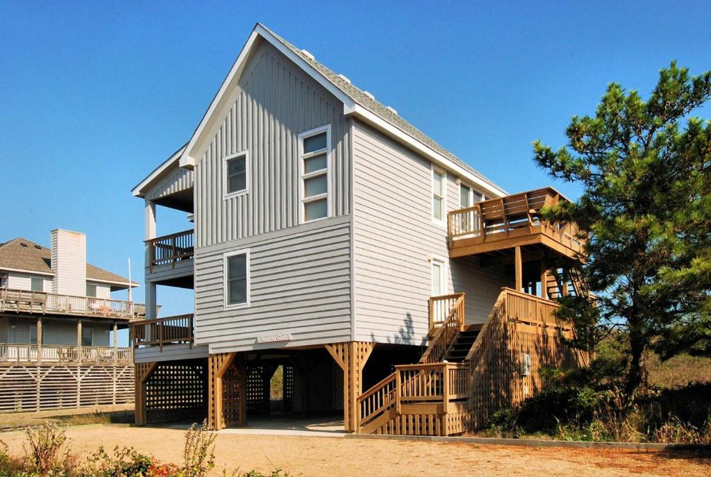 a large house with a wrap around porch at 2408 - Herring Gull in Duck