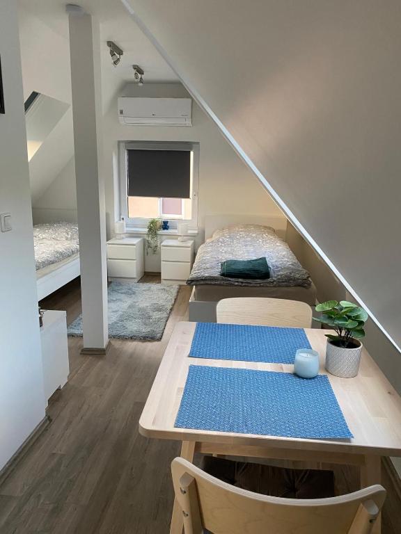 a room with a bed and a table in a room at R&A Unterkunft in Oberhausen