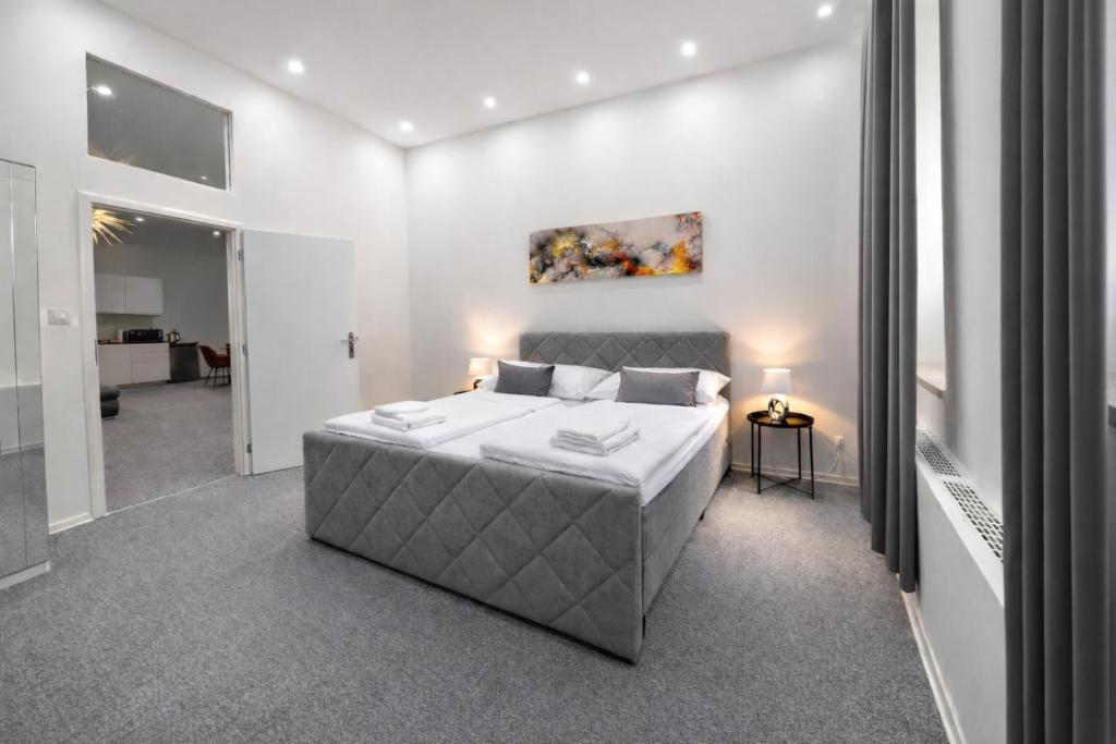 a bedroom with a bed and a painting on the wall at Beethoven Suite in Vienna