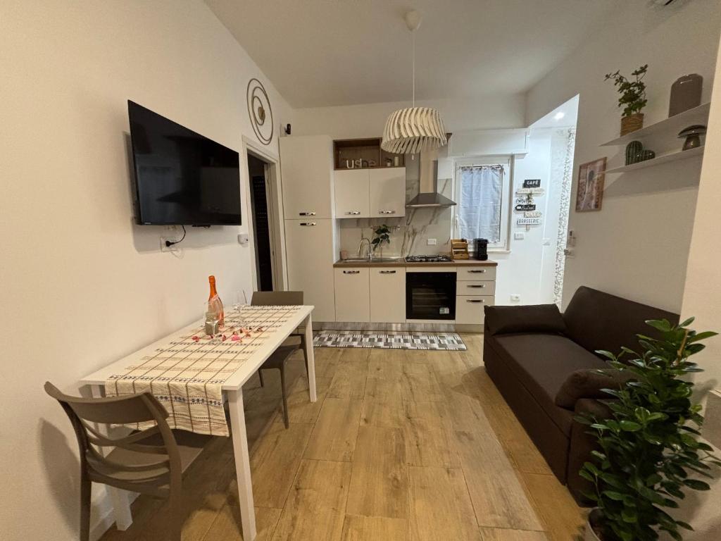 a living room with a table and a couch at Dolce Vita in Bari