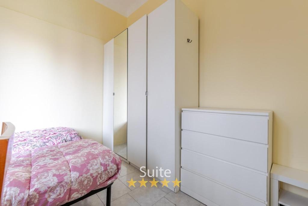 a bedroom with a bed and a dresser at Casa dell'amicizia in Milan