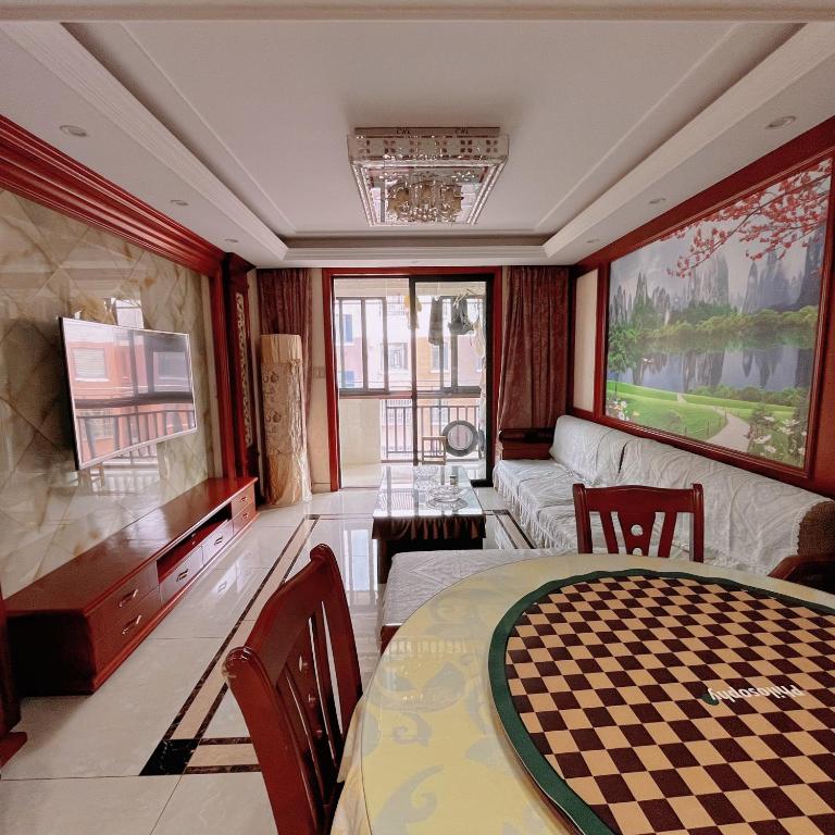 a living room with a table and a couch at 青云小栈 in Shaoxing