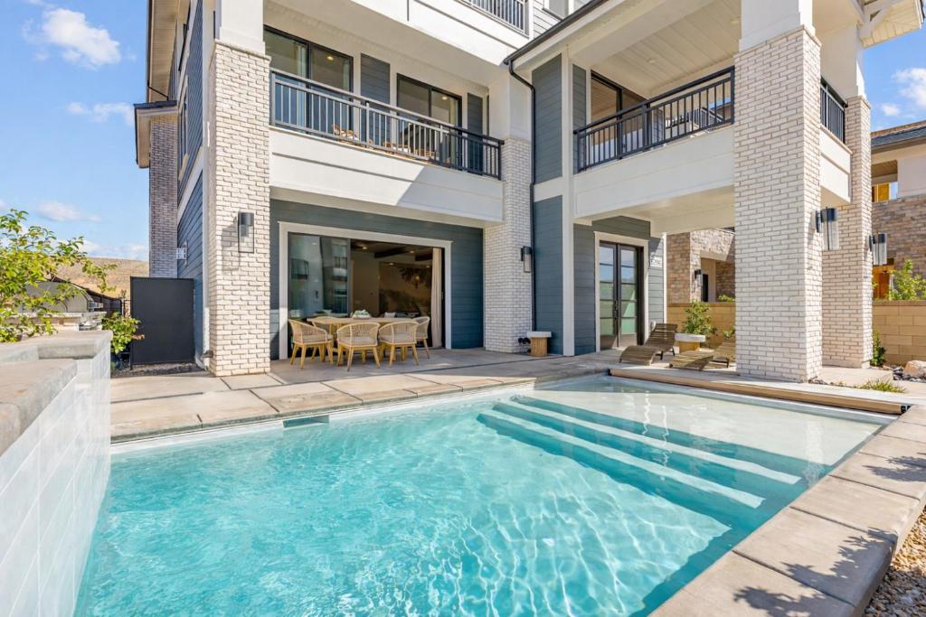 a swimming pool in the backyard of a house at The Boardwalk home in St. George