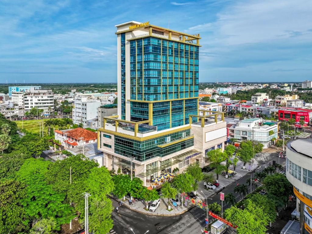 an overhead view of a tall building in a city at Cosmo Stars Hotel Bạc Liêu in Bạc Liêu