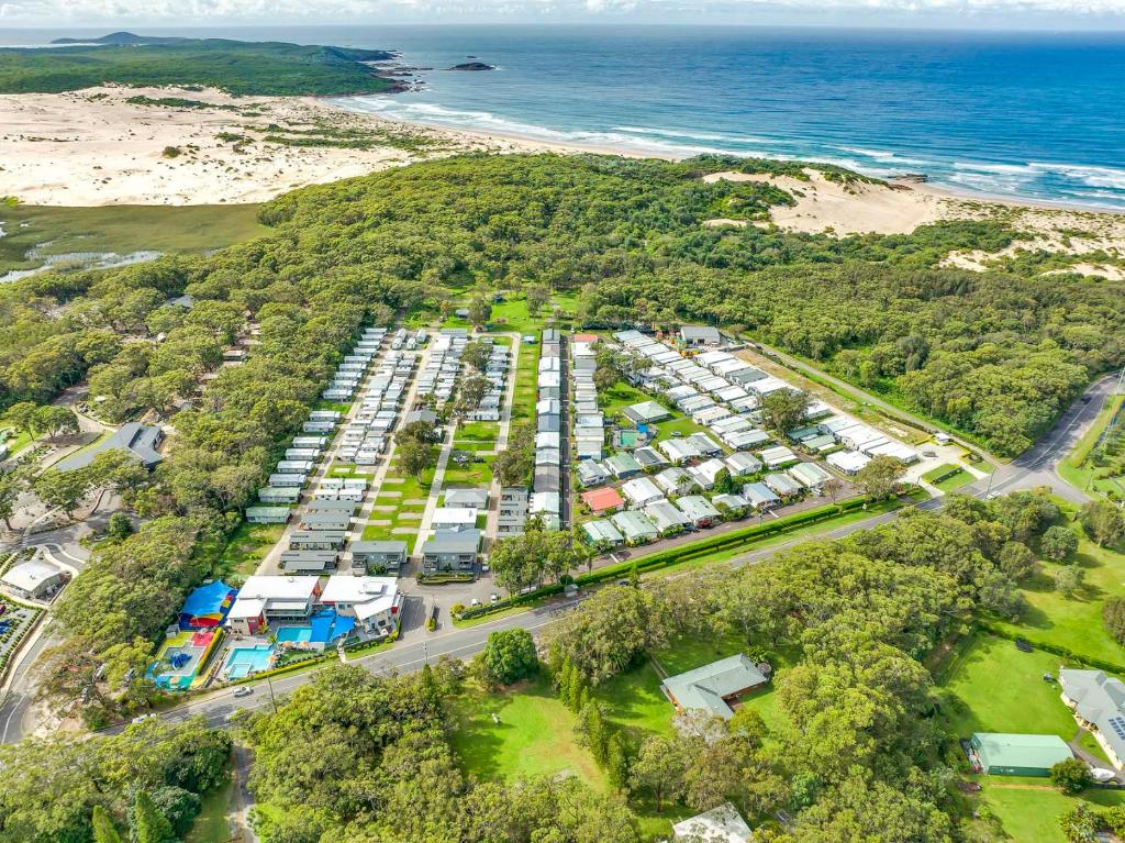 an aerial view of a parking lot next to the beach at Ingenia Holidays Middle Rock in One Mile