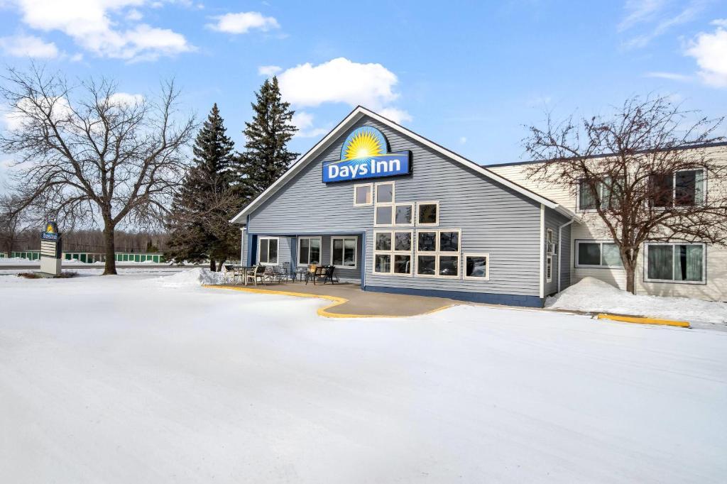 a building with a sign on the side of it at Days Inn by Wyndham International Falls in International Falls