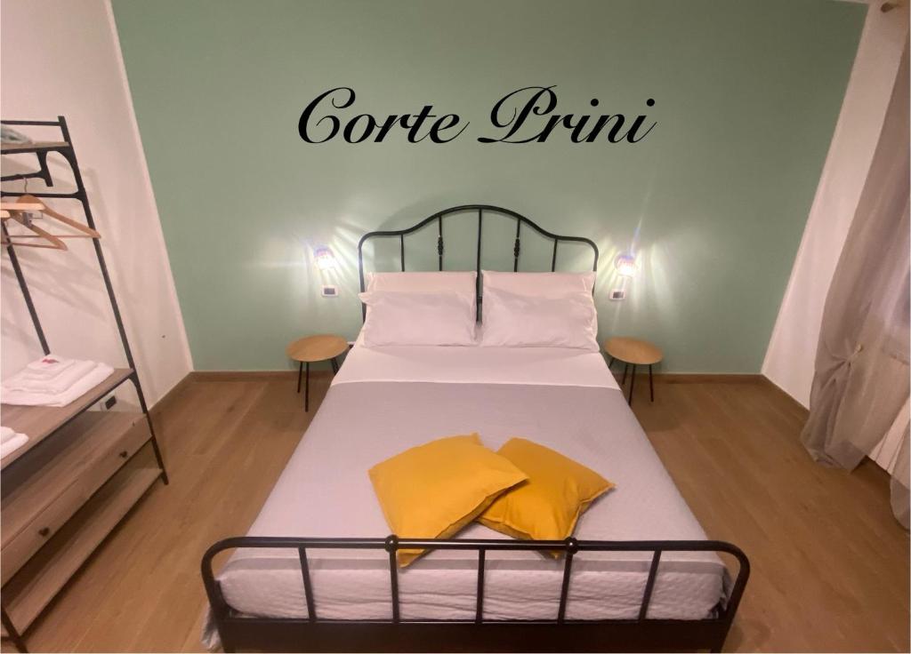 a bed in a room with a sign that reads coffee run at Corte Prini Fiumicino in Fiumicino