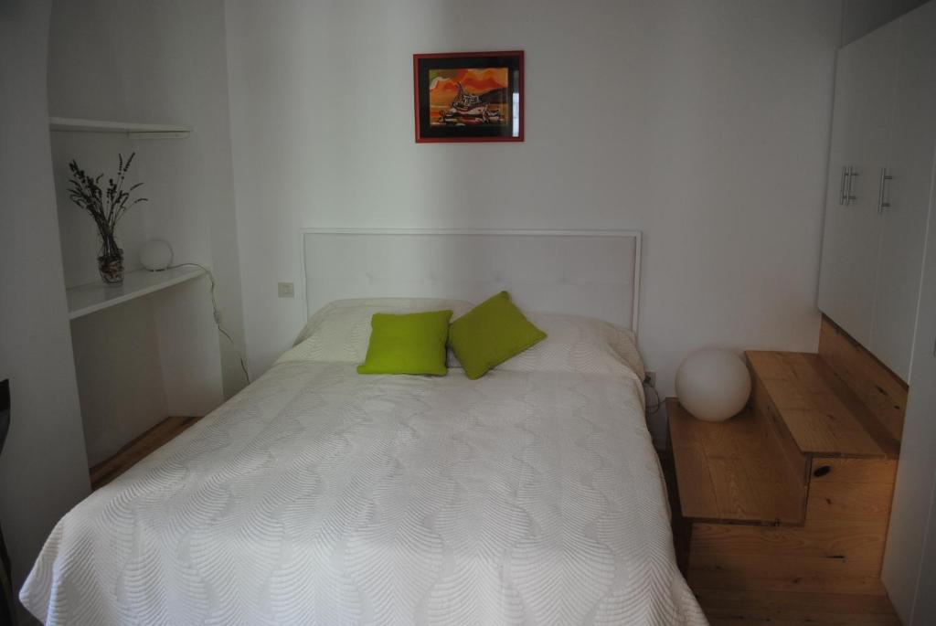 Postel nebo postele na pokoji v ubytování Rooms Piazzetta