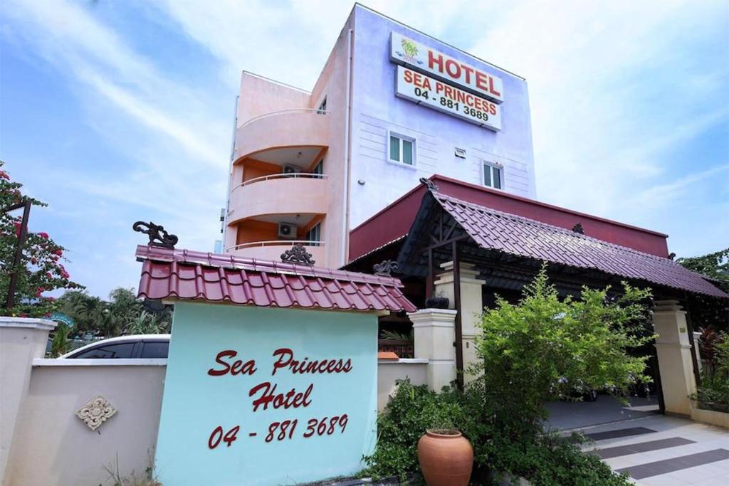 a hotel with a sign in front of a building at Hotel D'Sea Princess in Tanjung Bungah