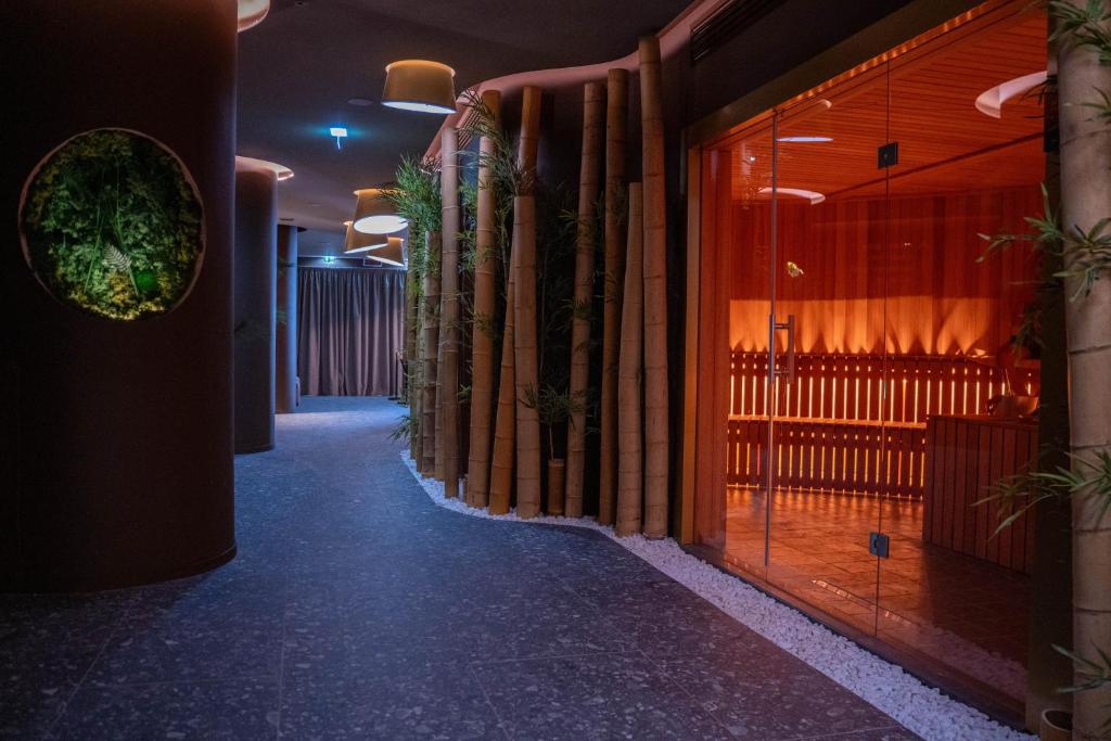 a hallway of a building with a row of windows at UNA Hotels One Catania Wellness & SPA in Catania