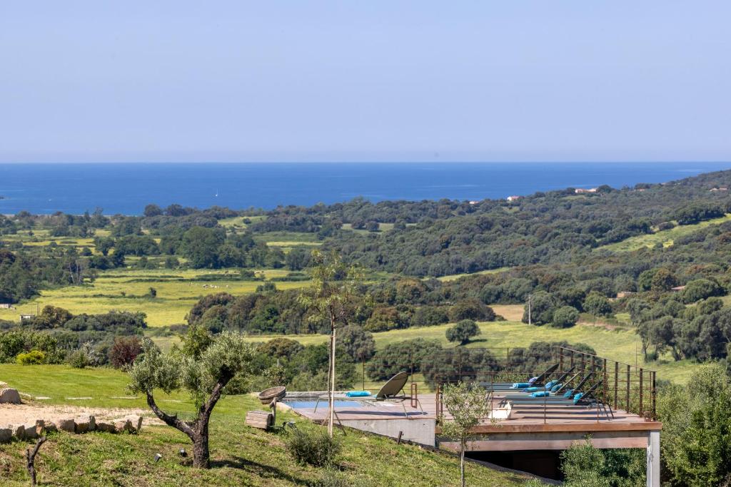 a view of the ocean from a hill at Bergerie face à Propriano in Fozzano