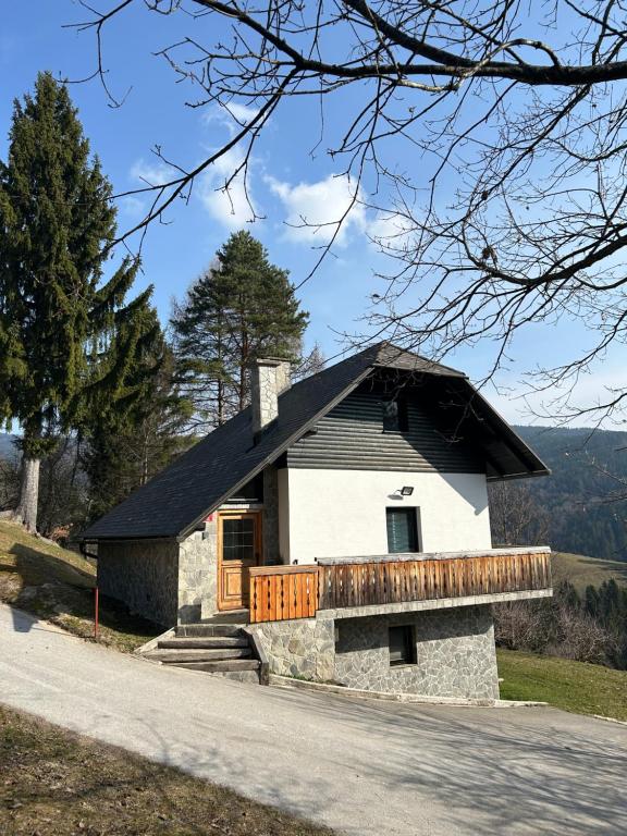 a small white house with a black roof at Chalet Rozika Rogla in Zreče