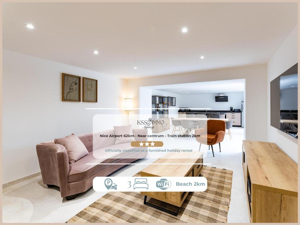 a living room with a couch and a table at Appart HOTEL 3 Chambres - parking - clim in Saint-Raphaël