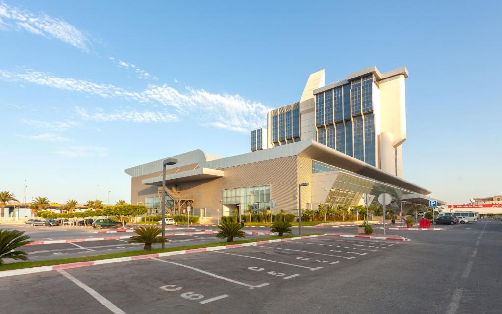 a parking lot in front of a large building at Radisson Blu Hotel & Convention Center, Tunis in Tunis