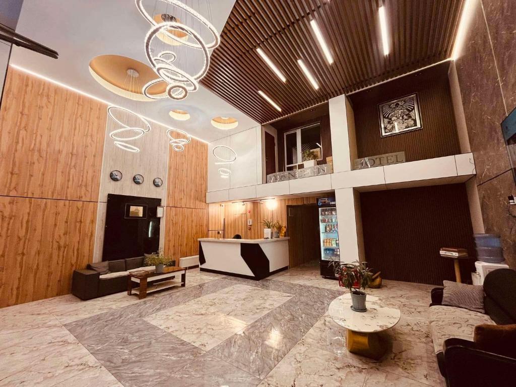 a lobby with a large room with a ceiling at Ayanchin Hotel in Ulaanbaatar