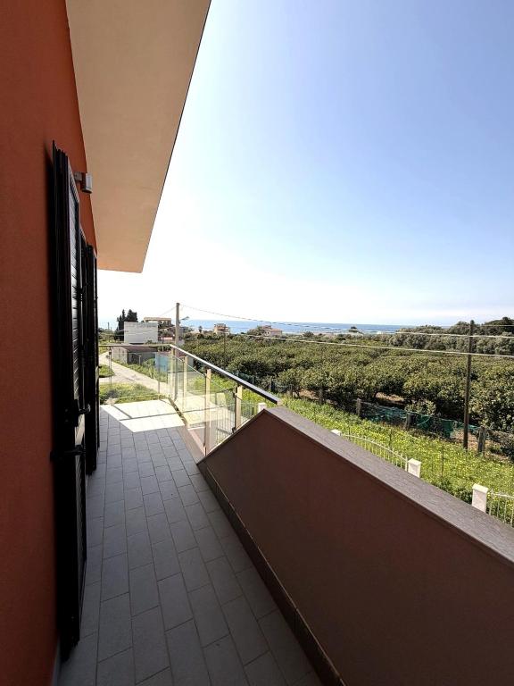 a room with a balcony with a view at Casa Decastadio in Melito di Porto Salvo