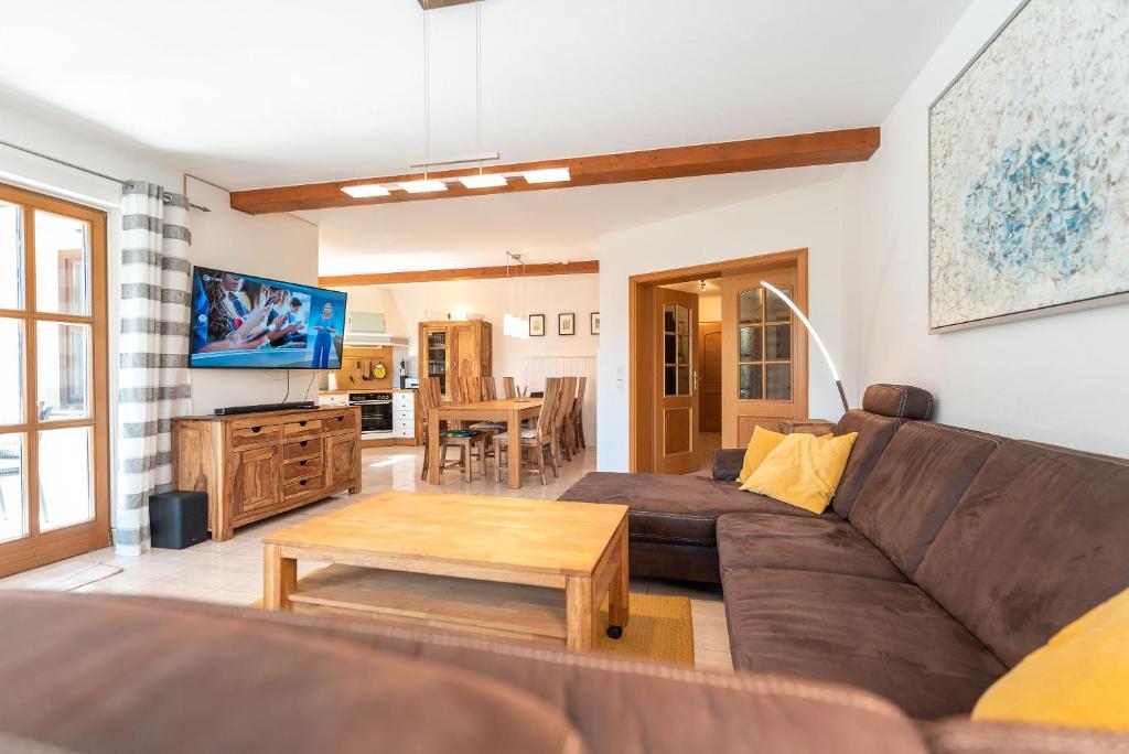 a living room with a couch and a coffee table at Ferienhaus MeerGenerationen in Ueckeritz