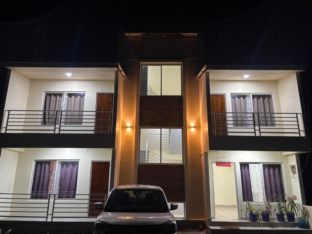 a car parked in front of a building at Spring Valley Homestay Rishop in Rishop