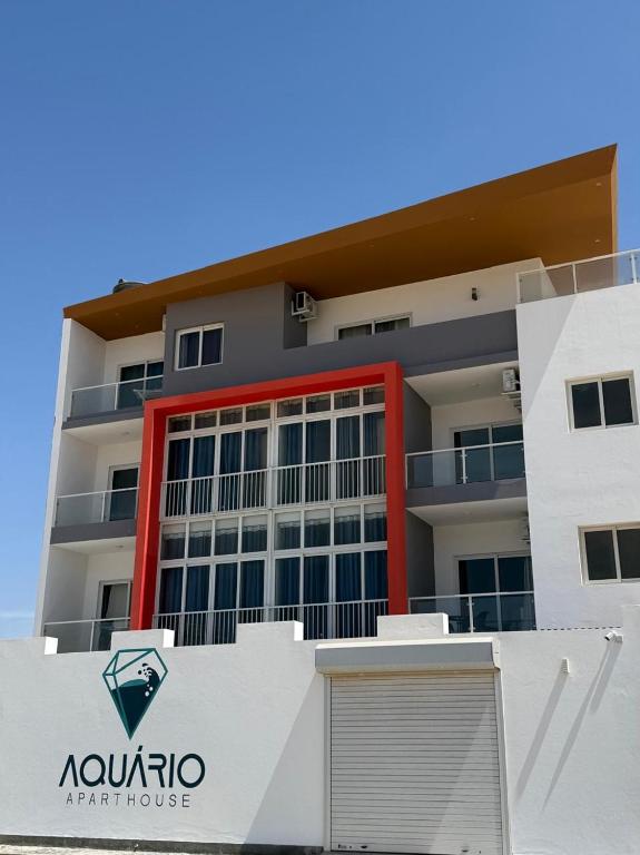 a building with aania art house in front of it at AQUÁRIO Apart Hotel in Sal Rei