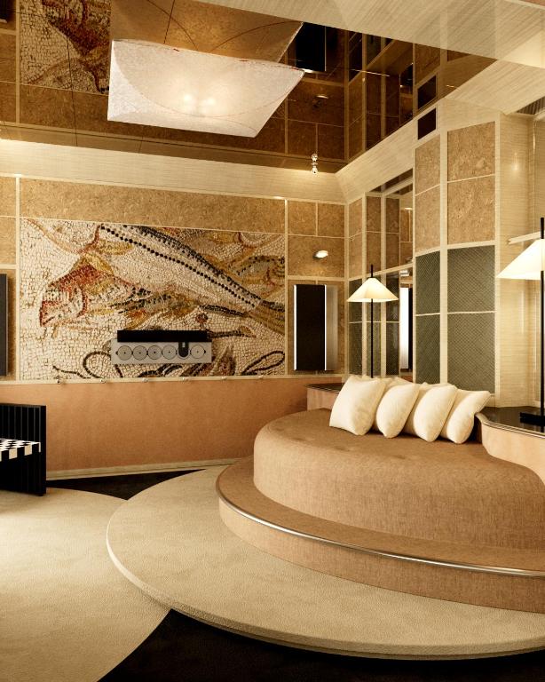 ein Schlafzimmer mit einem großen runden Bett mit Kissen in der Unterkunft Hôtel Luxia & Spa in Paris