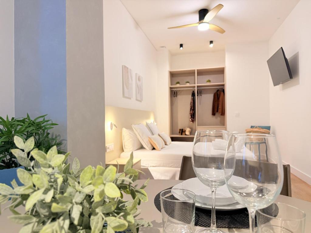 a living room with a table with wine glasses on it at Suite 1 Premium, accesible y luminoso by VidaCalma in Valencia