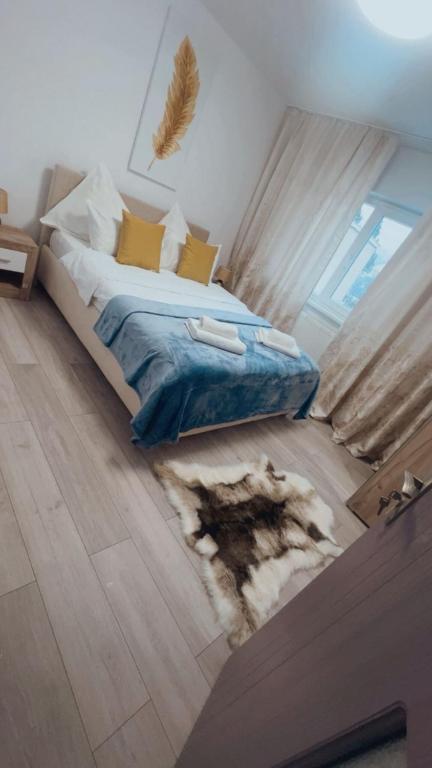 a bedroom with a bed with a rug on the floor at Mountain Retreat in Vulcan