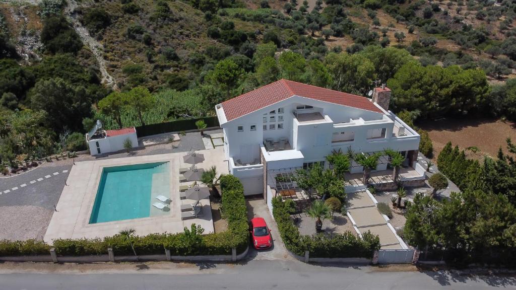 an aerial view of a house with a swimming pool at J&K Villa in Kalithies