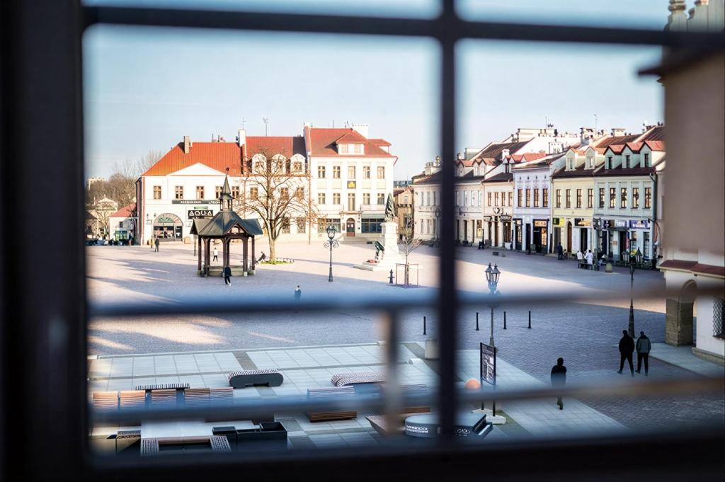a view from a window of a city street with buildings at IK Apartamenty in Rzeszów