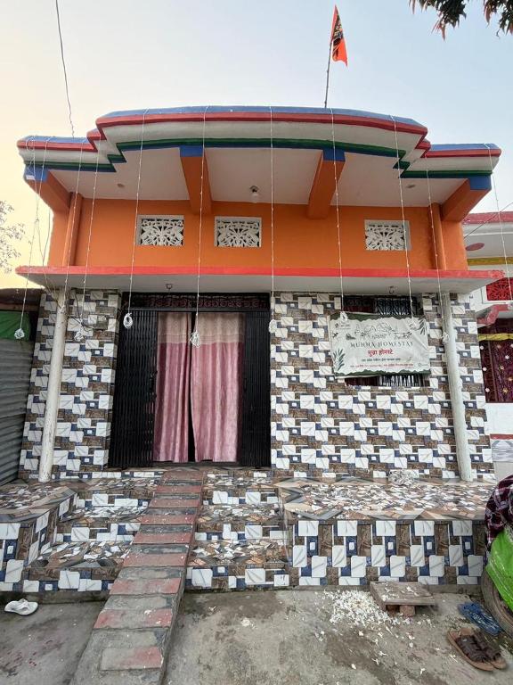 a building with a flag on top of it at New Giri Homestay in Nichlaul