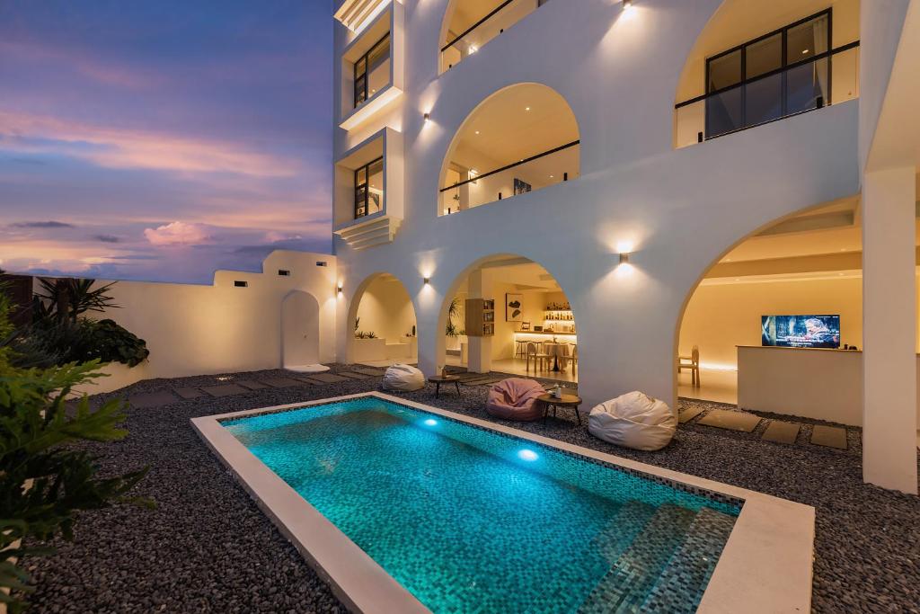 a swimming pool in the middle of a house at Mountain Resort Hotel in Dali