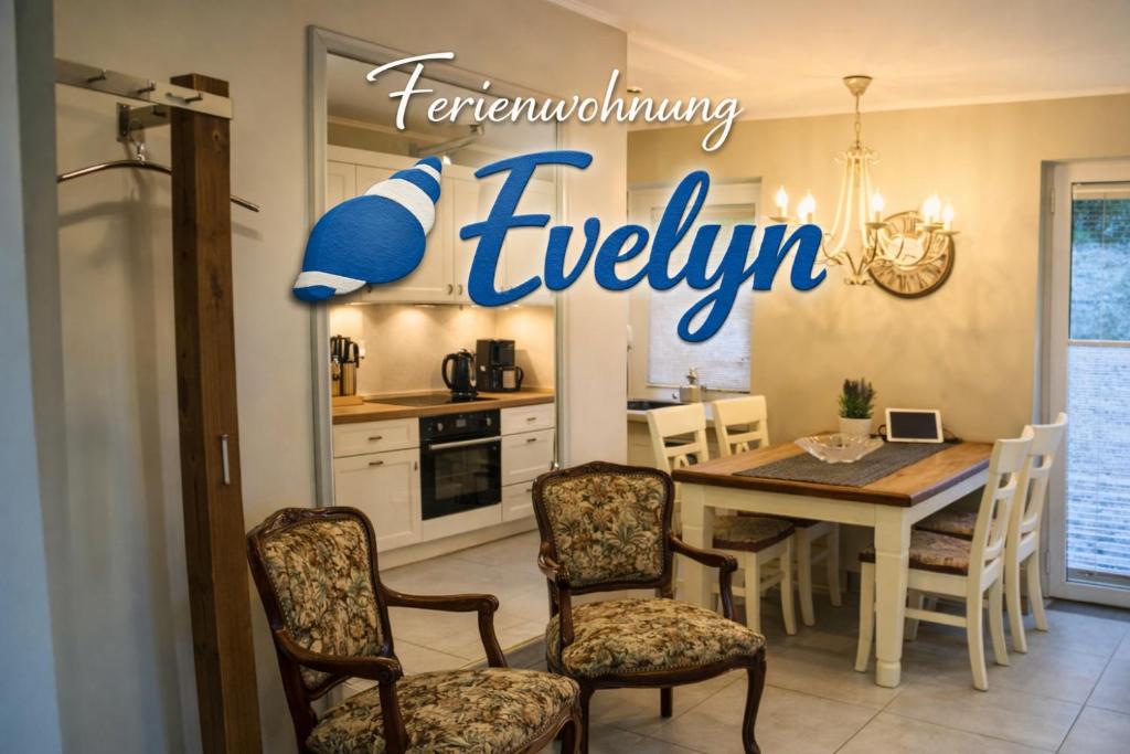 a kitchen and dining room with a table and chairs at Eine sehr gemütliche Erdgeschoß Wohnung in Ihlow