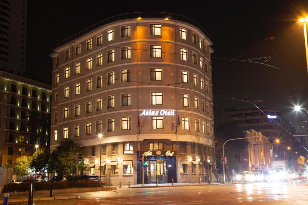a building with a sign on the side of it at ATLAS OTELİ in İzmir