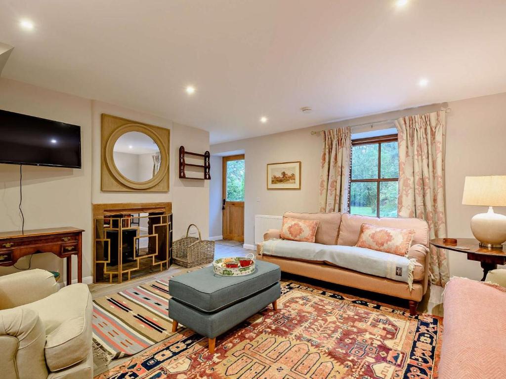 a living room with a couch and a table at 3 Bed in Lockerbie oc-89759 in Ecclefechan