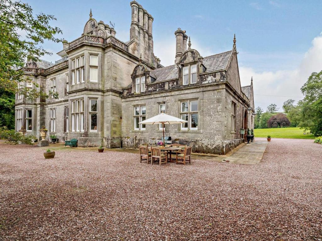 an old castle with a table in front of it at 2 Bed in Langholm oc-83344 in Langholm