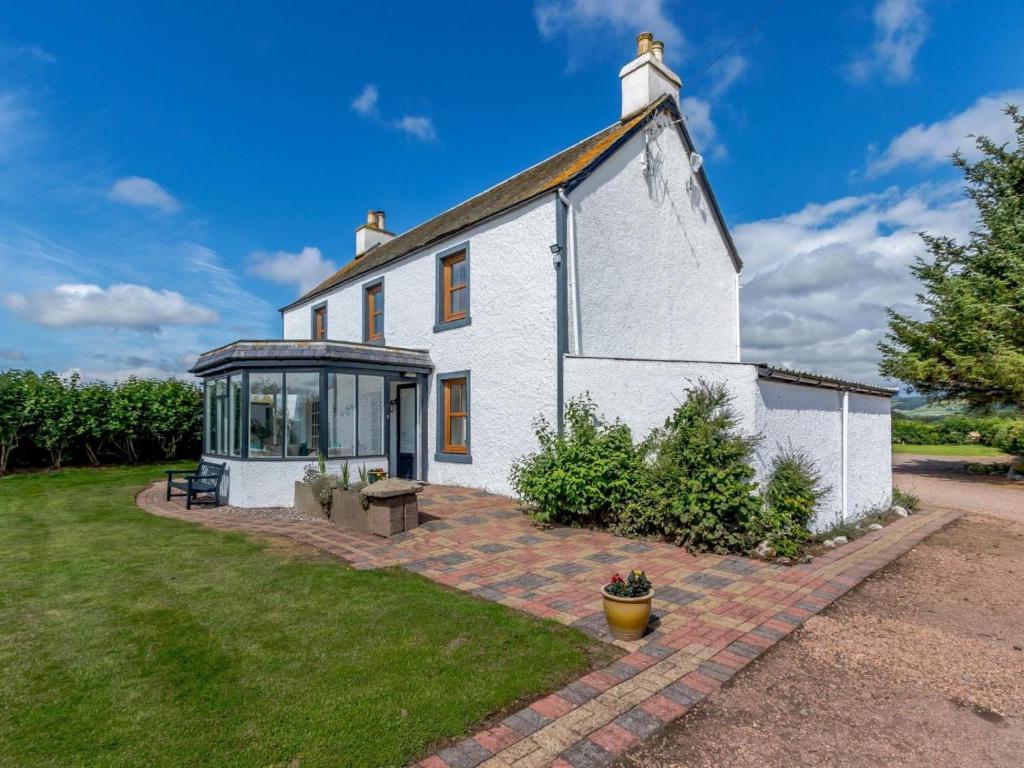 an old white house with a conservatory in the yard at 3 Bed in Crieff oc-78313 in Madderty